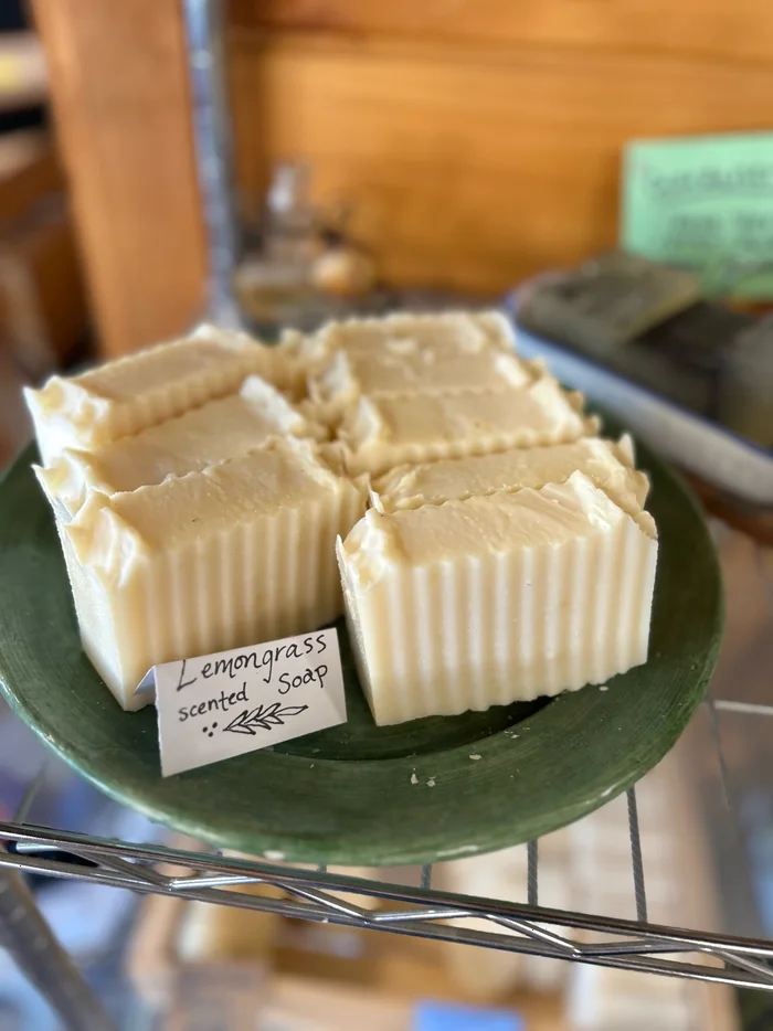 Four pale hand-cut bars on a green glass plate with a hand-written label.